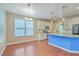 Bright kitchen featuring white cabinets, granite countertops, stainless steel appliances, and a breakfast bar at 1350 Wild Goose Trl, Summerville, SC 29483