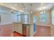 Spacious kitchen with island including stainless steel dishwasher, and view of the living and dining areas at 1350 Wild Goose Trl, Summerville, SC 29483
