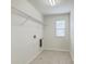 Utility room featuring tile floor, window and shelving at 1350 Wild Goose Trl, Summerville, SC 29483