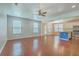 Open floor plan with hardwood floors seamlessly connecting the living room to the kitchen at 1350 Wild Goose Trl, Summerville, SC 29483