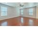 Bright and spacious living room featuring gleaming hardwood floors and large windows at 1350 Wild Goose Trl, Summerville, SC 29483