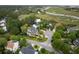 An aerial view features homes surrounded by lush greenery in an idyllic marsh community at 1417 S Jetties Ct, Mount Pleasant, SC 29466