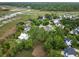 Aerial view of a waterfront community with docks and houses nestled among lush greenery at 1417 S Jetties Ct, Mount Pleasant, SC 29466