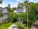 Beautiful two-story home with a spacious driveway, front yard, and mature trees at 1417 S Jetties Ct, Mount Pleasant, SC 29466