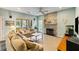Comfortable living room with hardwood floors, ceiling fan and a stone fireplace at 1417 S Jetties Ct, Mount Pleasant, SC 29466