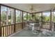 Screened porch area that allows you to enjoy the nature surrounding the property at 1417 S Jetties Ct, Mount Pleasant, SC 29466