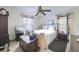 Bright bedroom featuring a ceiling fan, large bed and two large windows at 1430 Brian Rd, Charleston, SC 29407