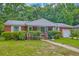 Charming single-story brick home with a landscaped front yard and covered entry at 1430 Brian Rd, Charleston, SC 29407