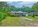 Quaint red brick home with a well-manicured lawn and inviting curb appeal at 1430 Brian Rd, Charleston, SC 29407