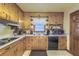 Functional kitchen with wooden cabinets and modern appliances for easy meal preparation at 1430 Brian Rd, Charleston, SC 29407