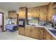 Functional kitchen with pine cabinets, tile floors and appliances and ample countertop space at 1430 Brian Rd, Charleston, SC 29407