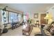 Bright living room featuring large windows and neutral decor, perfect for relaxation at 1430 Brian Rd, Charleston, SC 29407