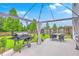 Backyard featuring a grill and pergola-covered patio with seating and a large lawn at 146 Chaste Tree Cir, Goose Creek, SC 29445