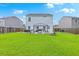 Spacious backyard featuring a well-maintained lawn, gazebo, and fire pit, perfect for outdoor gatherings at 146 Chaste Tree Cir, Goose Creek, SC 29445