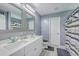Bathroom featuring double sink vanity with granite countertop, decorative mirrors, and light gray paint at 146 Chaste Tree Cir, Goose Creek, SC 29445