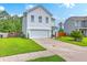 Two-story home with attached garage, a well-maintained lawn, and inviting landscaping, boosting curb appeal at 146 Chaste Tree Cir, Goose Creek, SC 29445