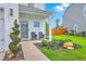 Cozy front porch with seating, decorative landscaping, and a charming entrance to the home at 146 Chaste Tree Cir, Goose Creek, SC 29445