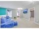 Upstairs loft area featuring plush seating, carpeting, and lots of natural light at 146 Chaste Tree Cir, Goose Creek, SC 29445