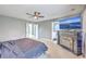Well-lit main bedroom with fireplace, ceiling fan, and plush bedding at 146 Chaste Tree Cir, Goose Creek, SC 29445