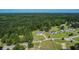 Aerial view of a home in a serene, wooded neighborhood with large lots at 148 Hidden Hills Rd, Cross, SC 29436