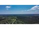 Lovely aerial view of the community surrounded by a gorgeous forest preserve under a beautiful sunny sky at 148 Hidden Hills Rd, Cross, SC 29436