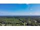 Lovely aerial view of the community surrounded by a gorgeous forest preserve under a beautiful sunny sky at 148 Hidden Hills Rd, Cross, SC 29436