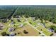 Gorgeous aerial view of the neighborhood with lush green lawns and mature trees surrounding beautiful homes at 148 Hidden Hills Rd, Cross, SC 29436