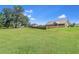 Lush, expansive backyard surrounded by mature trees and sturdy wooden fencing at 148 Hidden Hills Rd, Cross, SC 29436