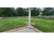 Large, green backyard with wood fence and mature trees at 148 Hidden Hills Rd, Cross, SC 29436