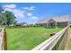 Expansive backyard featuring lush green grass and secure wooden perimeter fencing at 148 Hidden Hills Rd, Cross, SC 29436