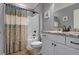 Bright bathroom featuring granite countertop and shower with decorative curtain at 148 Hidden Hills Rd, Cross, SC 29436