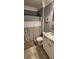 Neutral-toned bathroom with granite-topped vanity and shower at 148 Hidden Hills Rd, Cross, SC 29436