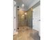 Bathroom featuring a walk-in shower with tiled walls and glass door at 148 Hidden Hills Rd, Cross, SC 29436