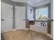 Bathroom featuring tub, tiled floor, decorative window, and neutral paint at 148 Hidden Hills Rd, Cross, SC 29436