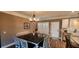 Bright dining room features hardwood floors, a chandelier, and white wainscoting at 148 Hidden Hills Rd, Cross, SC 29436