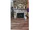 Stone fireplace with wooden mantel creating a cozy focal point at 148 Hidden Hills Rd, Cross, SC 29436