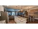 Open concept kitchen with island seating and seamless flow into the dining and living areas at 148 Hidden Hills Rd, Cross, SC 29436