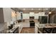 Modern kitchen with white cabinets, granite countertops, and stainless-steel appliances at 148 Hidden Hills Rd, Cross, SC 29436
