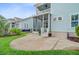 A backyard patio with a view of a screened porch and the exterior of the house at 1485 Bourne Xing, Mount Pleasant, SC 29466