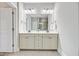 Bright bathroom featuring a double vanity with modern fixtures and a large mirror at 1485 Bourne Xing, Mount Pleasant, SC 29466