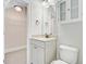 Bright bathroom with a white vanity, mirror, and cabinet above a toilet at 1485 Bourne Xing, Mount Pleasant, SC 29466