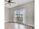 Inviting bedroom with hardwood floors, ceiling fan and French doors with natural light at 1485 Bourne Xing, Mount Pleasant, SC 29466