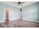 Spacious bedroom with hardwood floors, neutral walls, and multiple doorways at 1485 Bourne Xing, Mount Pleasant, SC 29466