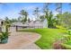Paver driveway, landscaping, and three-car garage, with a boat in the background at 1485 Bourne Xing, Mount Pleasant, SC 29466