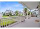 Expansive front porch offering neighborhood views, combining comfort and elegance for outdoor relaxation at 1485 Bourne Xing, Mount Pleasant, SC 29466