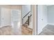 Upstairs hallway with hardwood floors and natural light at 1485 Bourne Xing, Mount Pleasant, SC 29466