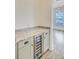 Butler's pantry featuring wine fridge, storage, and granite countertops at 1485 Bourne Xing, Mount Pleasant, SC 29466