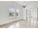 Bright living room showcases wood floors, large windows, and a modern light fixture at 1485 Bourne Xing, Mount Pleasant, SC 29466