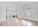 Spacious living room with wood flooring, stylish light fixtures, and lots of natural light at 1485 Bourne Xing, Mount Pleasant, SC 29466