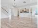 Bright living room showcasing wood floors and a view of a modern kitchen area at 1485 Bourne Xing, Mount Pleasant, SC 29466